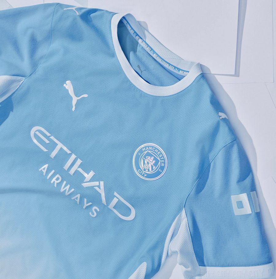 Not your typical City words on Man City shirt 26-27